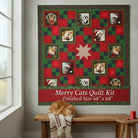 Carmon's Quilt Shop Merry Cats quilt kit featuring festive cat portraits in red and green holiday fabric squares.
