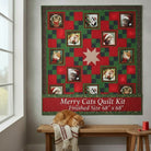 Carmon's Quilt Shop Merry Cats quilt kit featuring festive cat portraits in red and green holiday fabric squares.