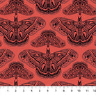 Carmon's Quilt Shop Indelible Ink fabric featuring black moth illustrations on a vibrant coral red cotton background