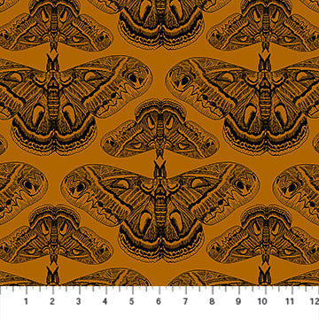 Carmon's Quilt Shop Indelible Ink fabric featuring black moth illustrations on a deep mustard yellow background