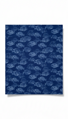 Carmon's Quilt Shop navy blue cotton fabric with a repeating fish pattern from the Northcott Coral Reef collection