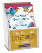 Carmon's Quilt Shop display box containing No Math Quilt Charts & Formulas pocket guides for quilting reference