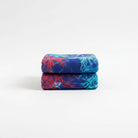 Carmon's Quilt Shop Oceana Coral 108 inch fabric featuring orange and blue coral reef patterns on deep blue cotton