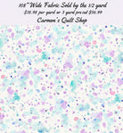 Carmon's Quilt Shop 108 inch wide cotton fabric featuring a colorful paint splatter pattern on a white background.