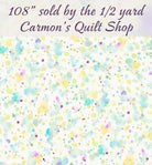 Carmon's Quilt Shop 108 inch wide cotton backing fabric featuring a colorful paint splatter design on a white background
