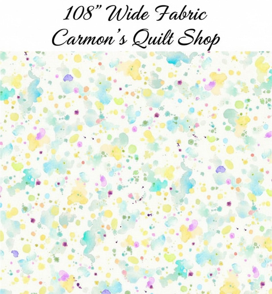 Carmon's Quilt Shop 108 inch wide cotton fabric featuring a colorful paint splatter pattern on a white background.