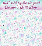 Carmon's Quilt Shop 108 inch wide cotton fabric featuring a colorful purple and teal paint splatter design.