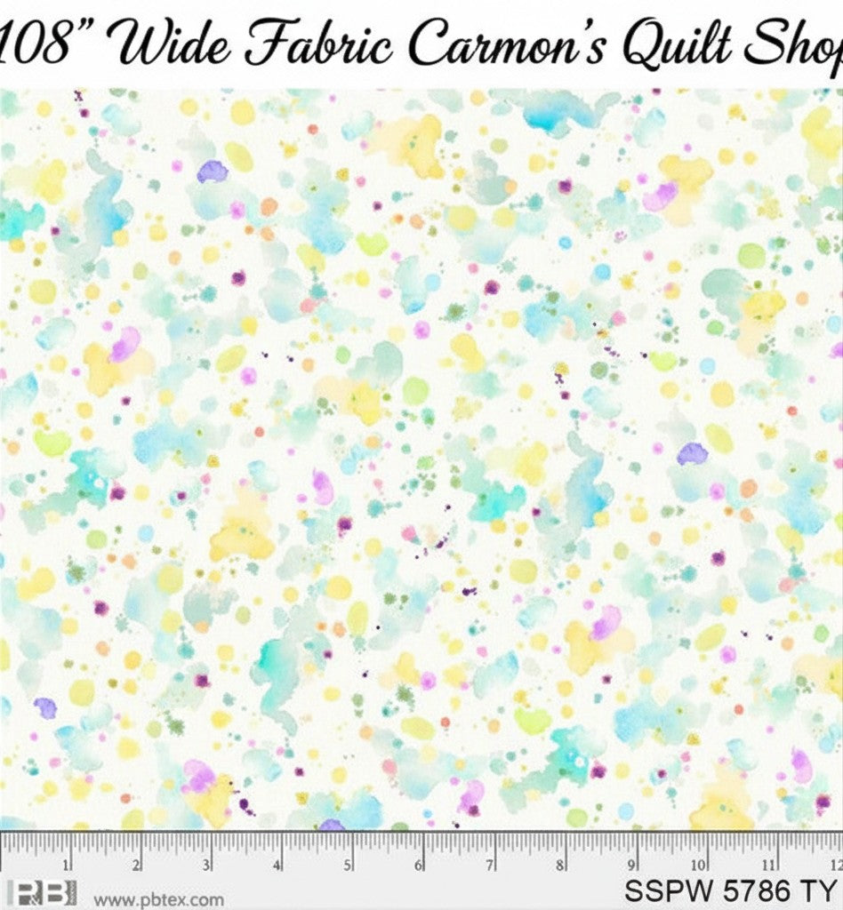 Carmon's Quilt Shop 108 inch wide cotton fabric featuring a colorful paint splatter pattern on a white background.
