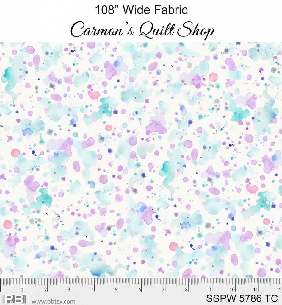 Carmon's Quilt Shop 108 inch wide cotton quilting fabric featuring a colorful paint splatter design on white.