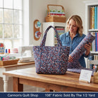 Carmon's Quilt Shop patriotic swirl 108 inch wide back cotton fabric used to make a tote bag in a sewing room