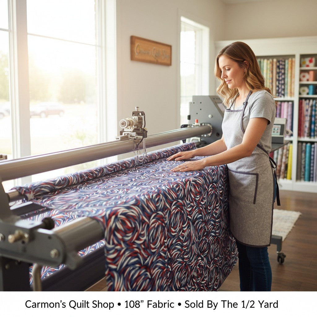 Carmon's Quilt Shop patriotic swirl 108-inch wide cotton quilt backing fabric being loaded onto a longarm machine.