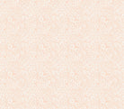 Carmon's Quilt Shop fabric featuring a delicate white floral print on a soft peach background for quilting projects.