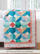 Carmon's Quilt Shop For the Love of Precuts pattern book features a colorful patchwork quilt with teal and coral tones.
