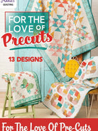 Carmon's Quilt Shop For the Love of Precuts pattern book featuring colorful patchwork quilts on display