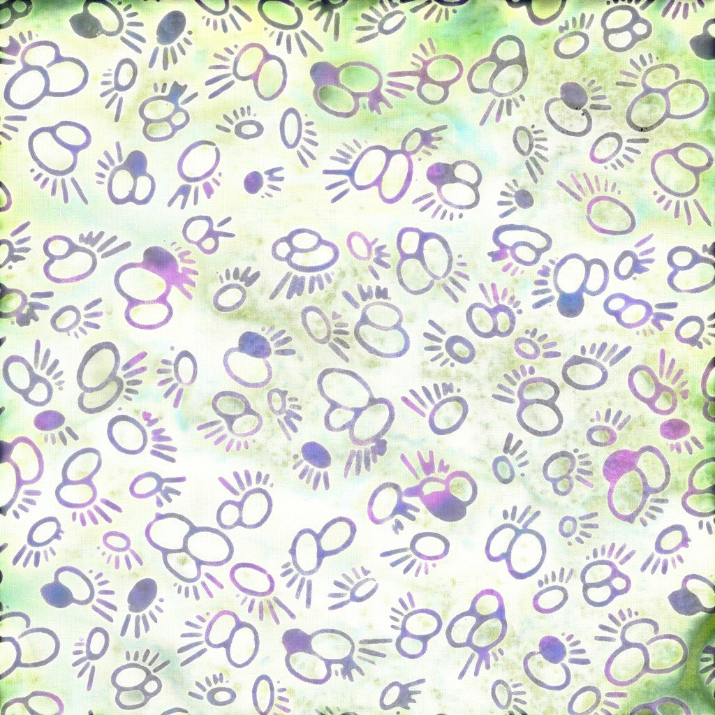 Carmon's Quilt Shop Island Batik fabric featuring purple and green abstract circular motifs on a light background