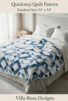 Carmon's Quilt Shop Quickstep quilt pattern featuring an interlocking blue and white diamond design on a bed.