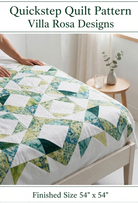 Carmon's Quilt Shop Quickstep quilt pattern featuring an interlocking green and white diamond design on a throw quilt.