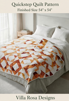 Carmon's Quilt Shop Quickstep quilt pattern by Villa Rosa Designs featuring an interlocking orange and white diamond design on a bed.