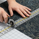 Carmon's Quilt Shop Raven's Call Black Multi dark forest branches 100% cotton quilt fabric with metallic silver and gold accents.