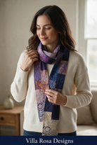 Carmon's Quilt Shop Savannah Jane wearable sewing pattern featuring a woman wearing a quilted purple patchwork scarf