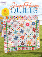 Carmon's Quilt Shop Scrap-Happy Quilt Pattern Book featuring colorful patchwork designs on a sunny outdoor lawn