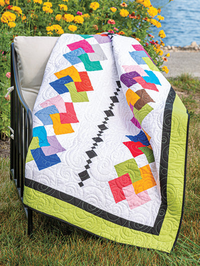 Carmon's Quilt Shop Scrap-Happy quilt pattern featuring colorful geometric fabric scraps on a white background