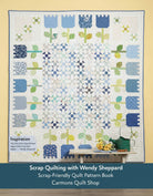 Carmon's Quilt Shop features a blue and white floral scrap quilt pattern from the book by Wendy Sheppard.