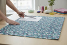Carmon's Quilt Shop Seaside Garden Cobalt 100% cotton fabric with a floral print in blue, white, and pink.