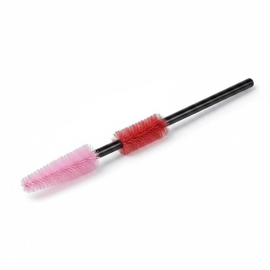 Carmon's Quilt Shop The Gypsy Quilter cleaning tool with pink and red silicone bristles on a black handle