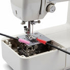 Carmon's Quilt Shop The Gypsy Quilter cleaning brushes with silicone bristles removing lint from a sewing machine
