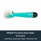 Carmon's Quilt Shop SINGER Pro Series seam roller with a teal handle and white plastic wheel for quilting and sewing