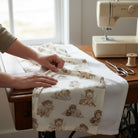 Carmon's Quilt Shop Soaring Dreams cream 100% cotton fabric featuring aviator bears on clouds. Jessica Yon Lo designer.