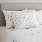Carmon's Quilt Shop Soaring Dreams white 100% cotton fabric with scattered gray and blue numbers. Jessica Yon Lo designer.