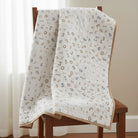 Carmon's Quilt Shop Soaring Dreams white 100% cotton fabric with scattered gray and blue numbers. Jessica Yon Lo designer.