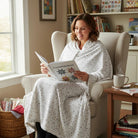 Carmon's Quilt Shop Soaring Dreams white 100% cotton fabric with gray-blue stars, ideal for quilting projects.