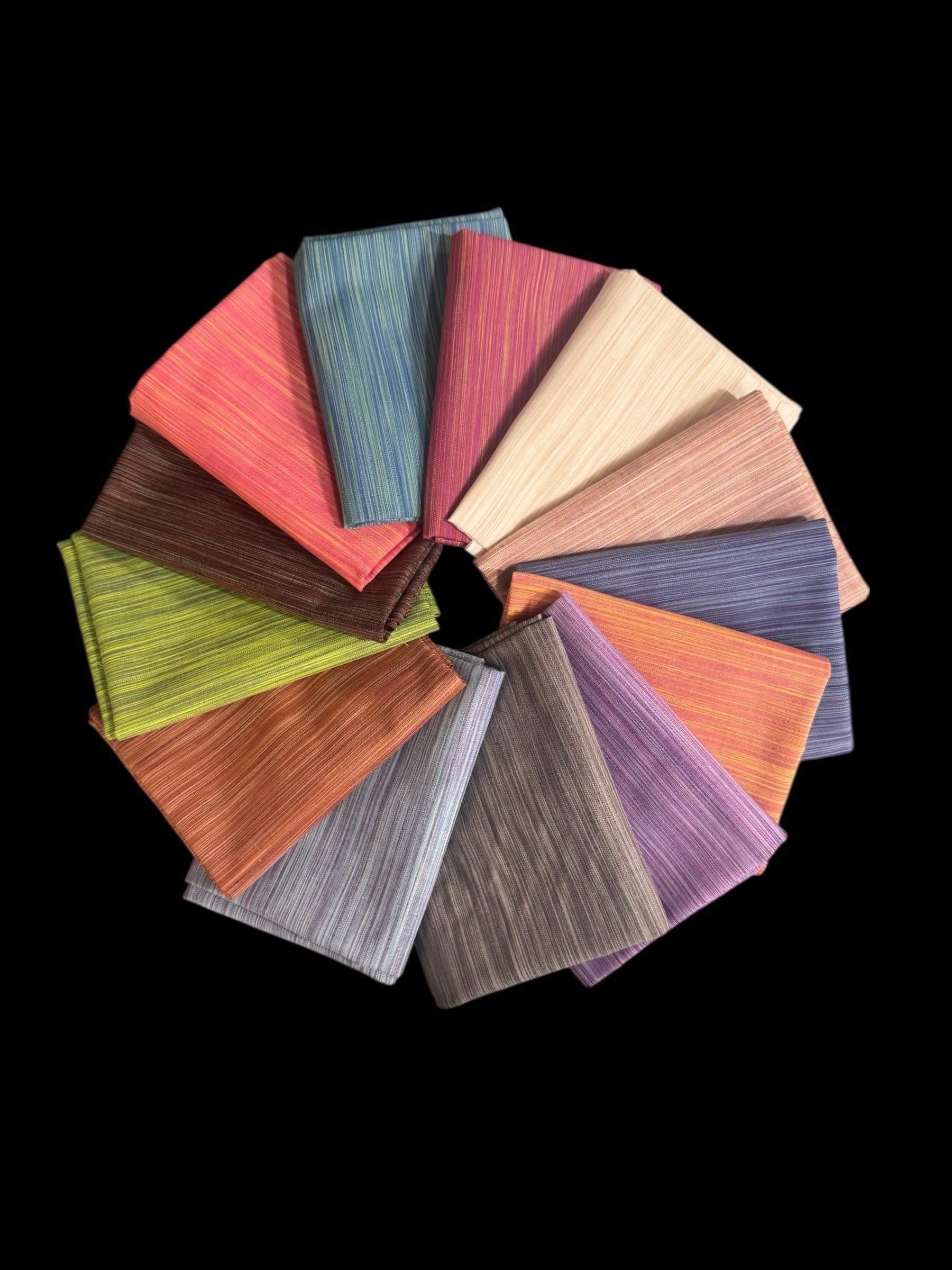Carmon's Quilt Shop Figo Studio Space Dye fat quarter bundle featuring 13 colorful textured fabric pieces in a circle