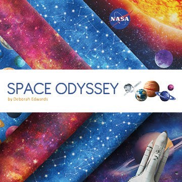 Carmon's Quilt Shop Space Odyssey fabric panel featuring NASA imagery, planets, stars, and a space shuttle design.