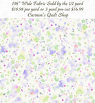 Carmon's Quilt Shop 108 inch wide cotton backing fabric featuring a colorful paint splatter pattern on white