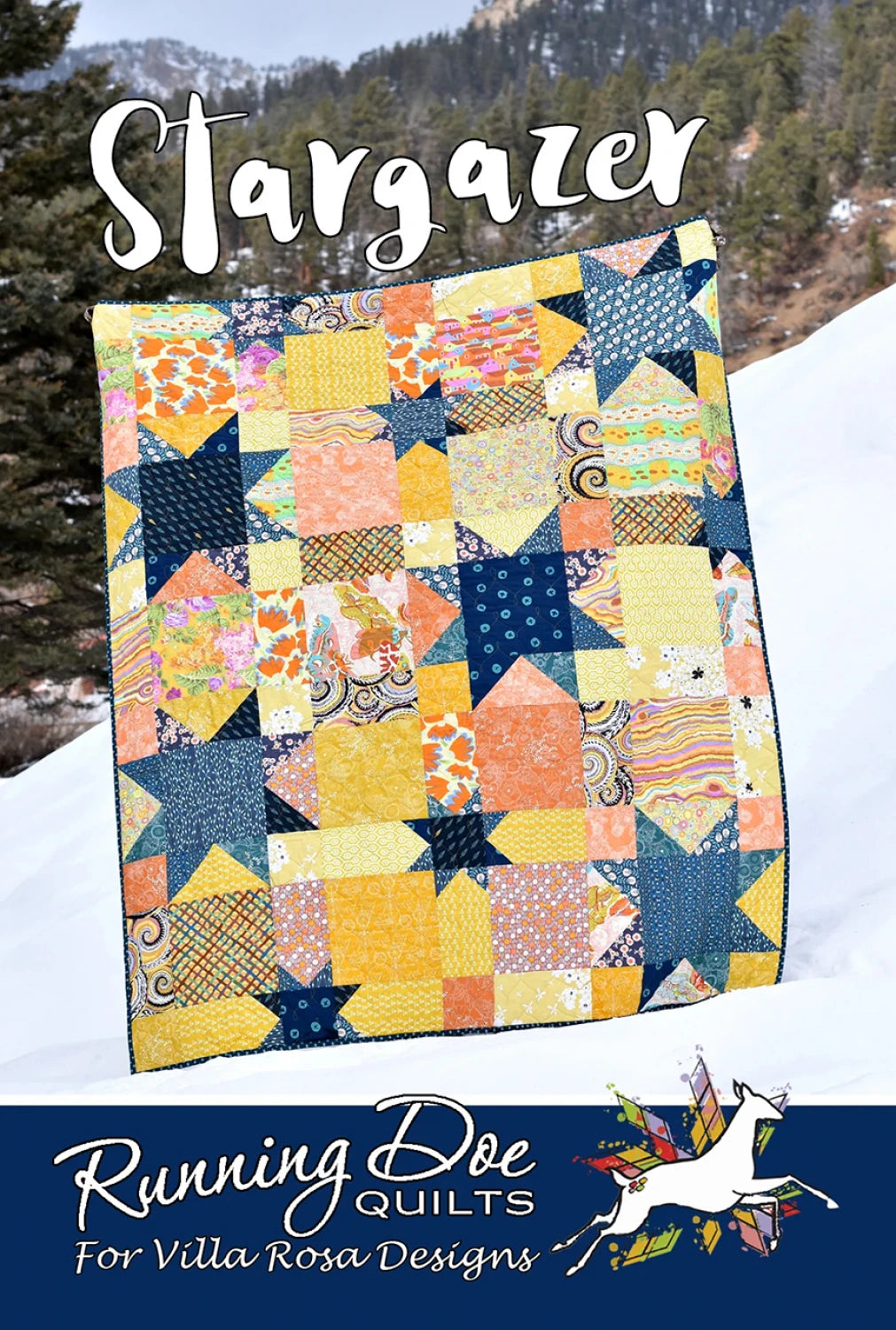Carmon's Quilt Shop Stargazer quilt featuring a colorful star pattern made from fat quarters in a snowy outdoor setting