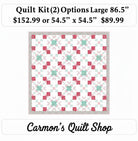 Carmon's Quilt Shop Starry-Eyed quilt kit featuring floral 100% cotton fabric in pink and teal geometric patterns.