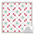 Carmon's Quilt Shop Starry-Eyed quilt kit featuring floral pink and green cotton fabric in a geometric star pattern.