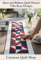 Carmon's Quilt Shop Stars & Ribbons table runner featuring red, white, and blue star blocks on a wooden dining table