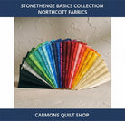 Carmon's Quilt Shop Stonehenge Basics 28-piece fat quarter bundle of premium cotton quilting fabric in a rainbow fan.