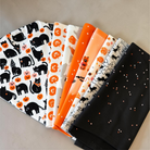 Carmon's Quilt Shop FIGO Fabrics Sweet Treat cotton quilting fabric featuring black cats and orange pumpkins