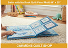 Child reading a soft fabric book made from the Carmon's Quilt Shop Swim with Me underwater themed quilt panel
