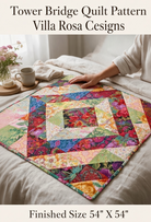 Carmon's Quilt Shop Tower Bridge quilt pattern featuring a colorful central diamond design on a neutral bedspread