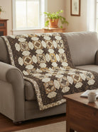 Carmon's Quilt Shop Fabric Café Vintage 3-yard quilt pattern featuring brown and cream star motifs on a sofa