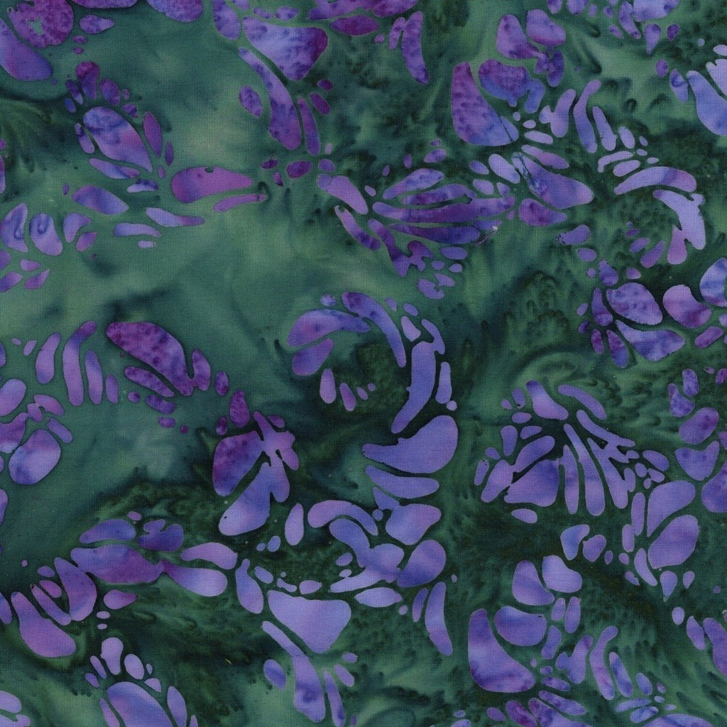 Carmon's Quilt Shop Vintner's Treasure Island Batik fabric in purple and green with a swirling organic pattern
