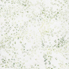 Carmon's Quilt Shop Vintner's Treasure batik fabric featuring a white background with small green U-shaped motifs.