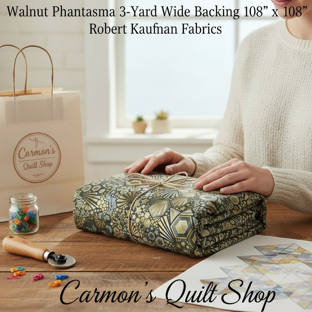 Carmon's Quilt Shop walnut geometric starburst hexagon cotton quilt backing fabric folded on a wooden table.